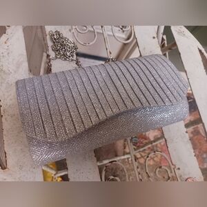 Silver chained clutch.
